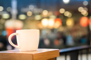 White coffe cup with lighting bokeh background
