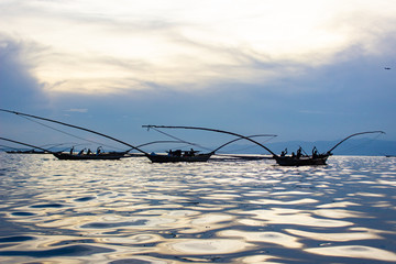 Fishing Canoes on Lake Kivu, Rwanda, with the Sun's Reflection on Water