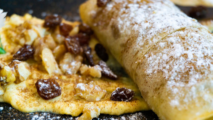 Puff pastry cake with custard and raisins.