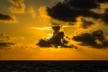 Orange sunset above Atlantic ocean horizon, Florida, USA