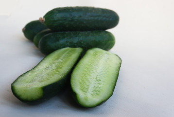 Cucumbers whole and halves. Candid.