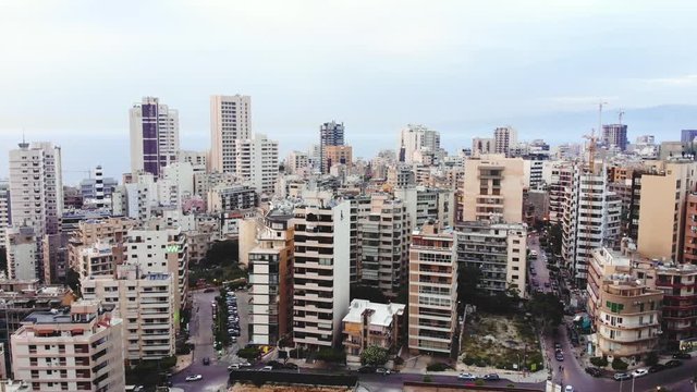 Aerial footage of downtown Beirut, Lebanon, at the sunset. Beirut skyline with skyscrappers in the evening, drone footage. Camera ascending over Beirut downtown.