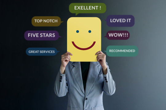 Customer Experience Concept. Happy Client standing at the Wall with Smiling Face on Paper. Surrounded by Positive Review in Speech Bubble