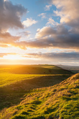 Beautiful Autumn Fall landscape of South Downs National Park in English countryside in late afternoon light