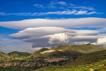Volcano Etna covered by a lenticolar cloud, Sicily