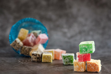 Traditional turkish delight on grey background. Side view