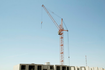 Constructions cranes near building. Construction site with crane and building.
