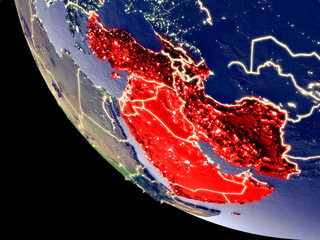 Orbit view of Western Asia at night with bright city lights. Very detailed plastic planet surface.