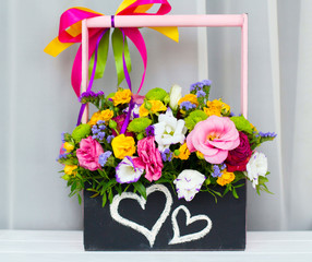 Roses in a brides flower bouquet in wooden box