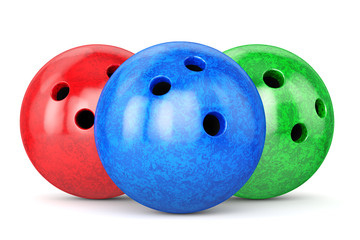 Red, green and blue glossy bowling balls isolated on white