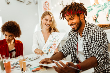 Handsome bearded man with dreadlock feeling joyful