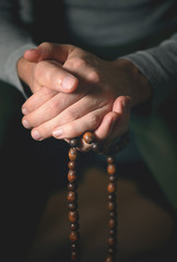 Prayer beads for meditation in men's hands. Peace, awareness and mindfulness