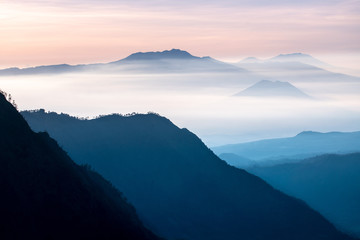 Fototapeta na wymiar foggy and mountain , twilight time show colorful of light