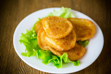 potato pancakes with lettuce leaves in a plate