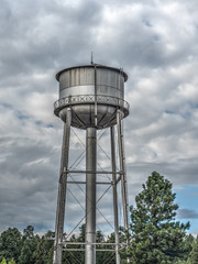 Water tower against stormy sky, Flagstaff Arizona