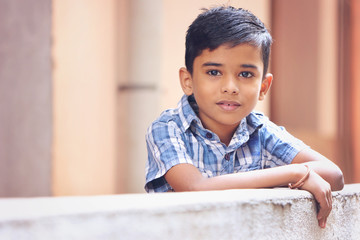 Portrait of Indian Little boy Posing to Camera with Cheerful Expression