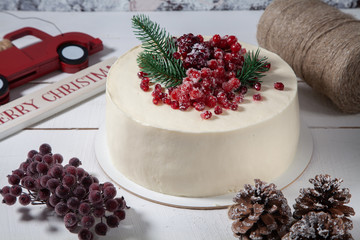 Beautiful birthday cake decorated with red berries.
