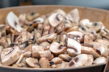 Mushrooms are fried in a pan