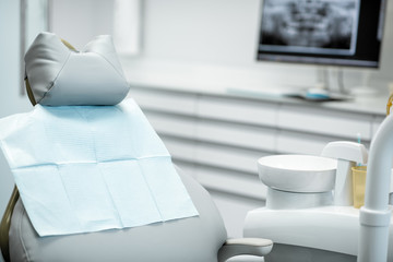 Dental chair with napking in the dental office