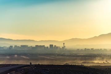 Truck on highway with hazy Las Vegas skyline in the distance