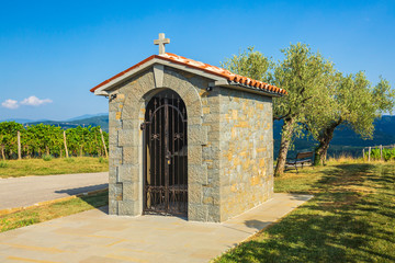 Traditional historic small chapel near a vineyard in Croatia on a summer day