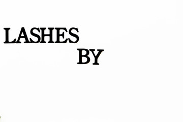 close-up of a black signboard on a white wall