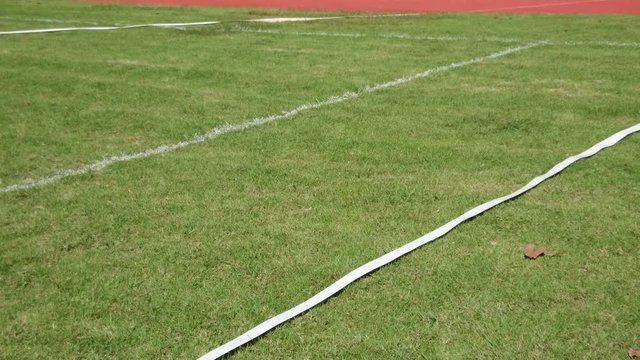 Discus throwing in the sport stadium on grass.