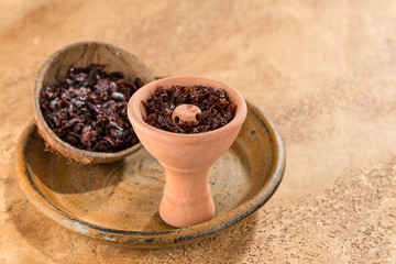 Shisha in the clay bowl made for Smoking hookah