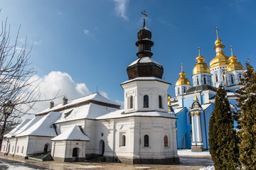 Fototapeta na wymiar White church inside the St. Michael's Monastery in Kiev, Ukraine (Europe) in Winter