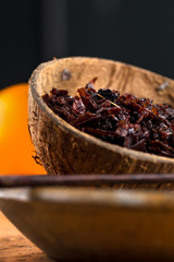 Close-up apple shisha in coconut shell. Preparation for hookah smoking