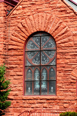 Fototapeta na wymiar Arched stained glass window