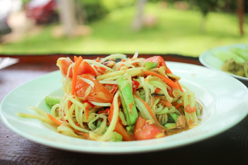 Close up of Original Thai papaya salad called Somtum in a dish.