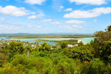 View of Noosa Heads and its clear sandy bay from Laguna Lookout on a sunny summer day near Noosa National Park (Queensland, Australia)