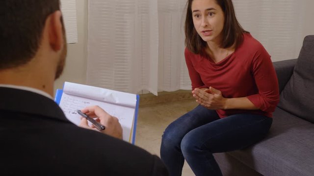 angry nervous young woman talking with the Psychologist-Therapy Session