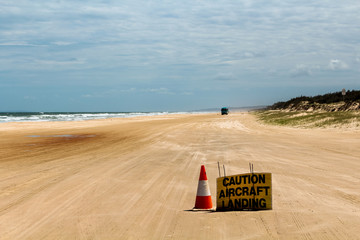Provisional runway with warning sign at Seventy Five Mile Beach on Fraser Island (Queensland,...