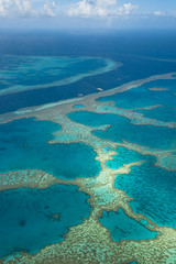 Great Barrier Reef as seen from above from a plane at the coast of the Whitsunday Islands (Queensland, Australia)