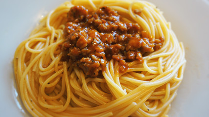 Plate of delicious spaghetti Bolognaise or Bolognese with sauce