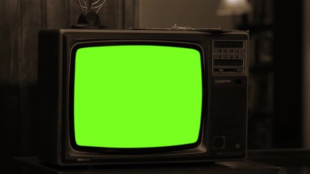 80s TV Turning On Green Screen. Sepia Tone. You can replace green screen with the footage or picture you want with &ldquo;Keying&rdquo; effect in AE  (check out tutorials on YouTube).