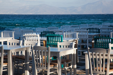 restaurant chairs and tables by the sea