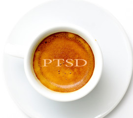 text ptsd on espresso cup of coffee on white background