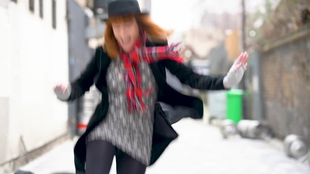 British fashion ginger female model with hat walking the streets of London