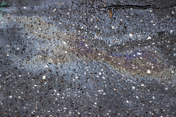 Oil spill wet asphalt pavement  texture surface
