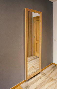 Mirror with wooden frame