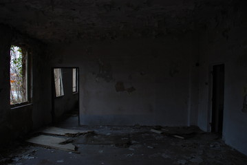 Door into empty room of abandoned building 