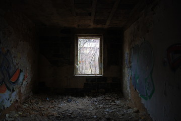 Abandoned dirty room with broken window, urbex 