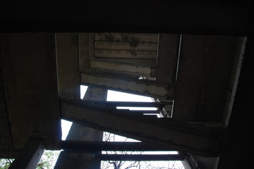 Bottom view of stone staircase in abandoned building, urbex 