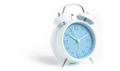 Narrow focus to clock with time 10 past 12 or 10.00 AM PM, blue clock face, on white background