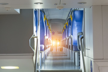 Salon inside of the speed commuter train with empty seats.