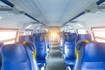 Salon inside of the speed commuter train with empty seats.