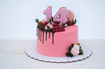 beautiful birthday cake with the number fourteen
